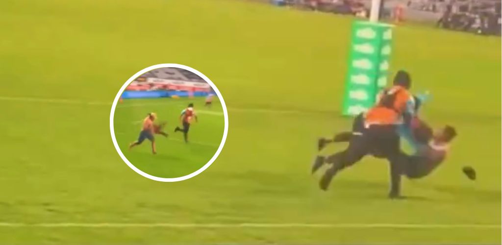 Pitch invader melted in thunderous tackle
